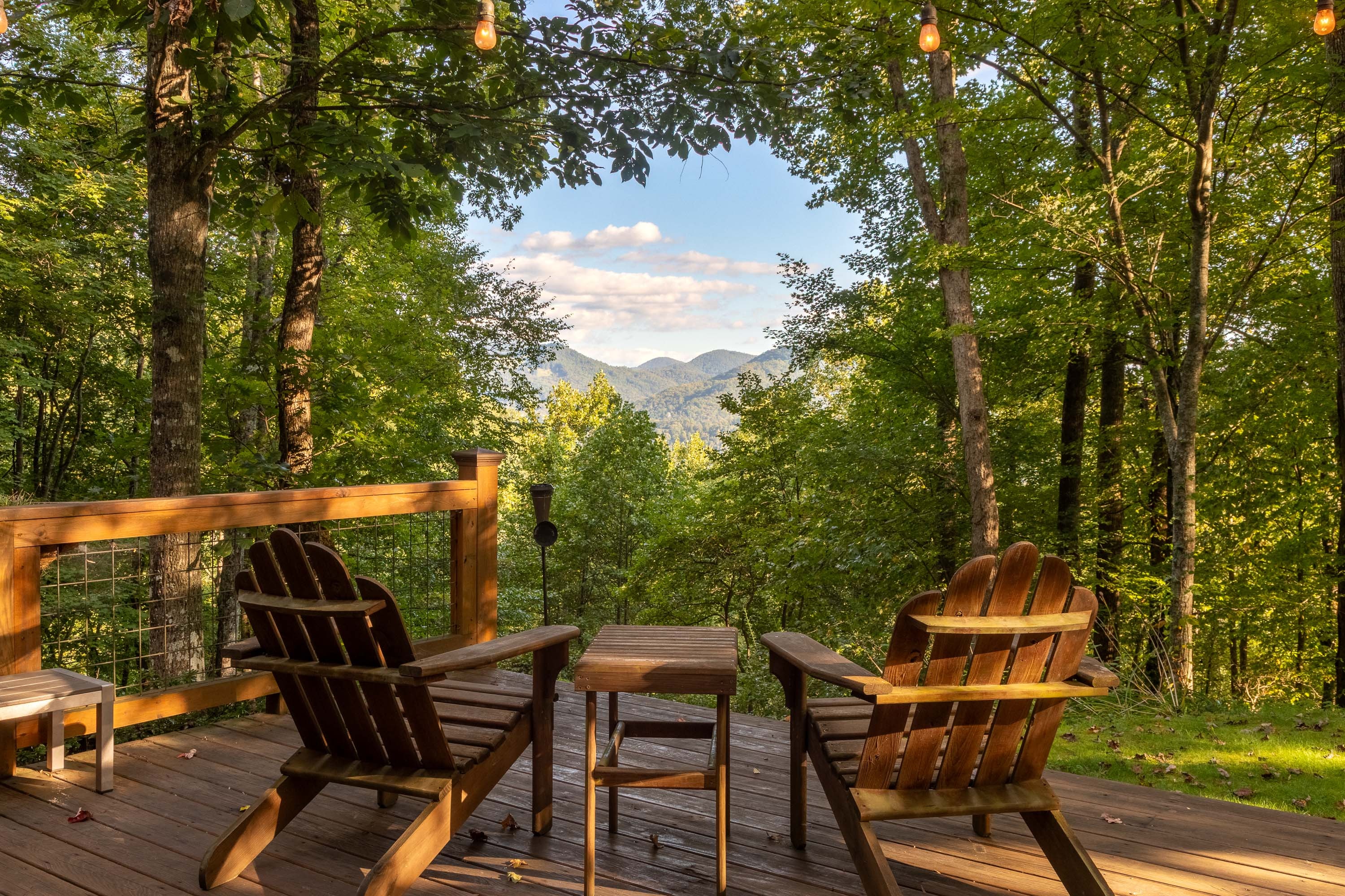 Mountain view deck with Adirondack chairs